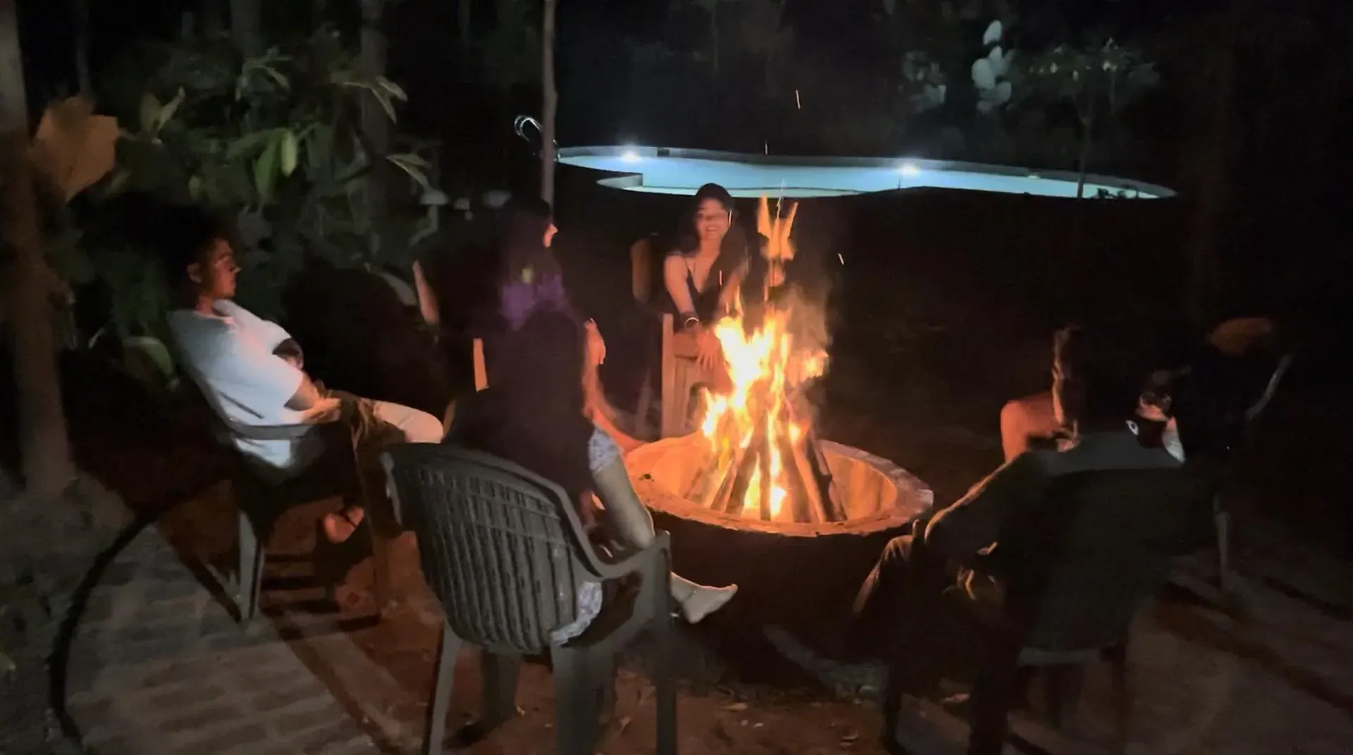 Nightly bonfire by the pool at Virama Farm Stay near Bangalore — included every evening